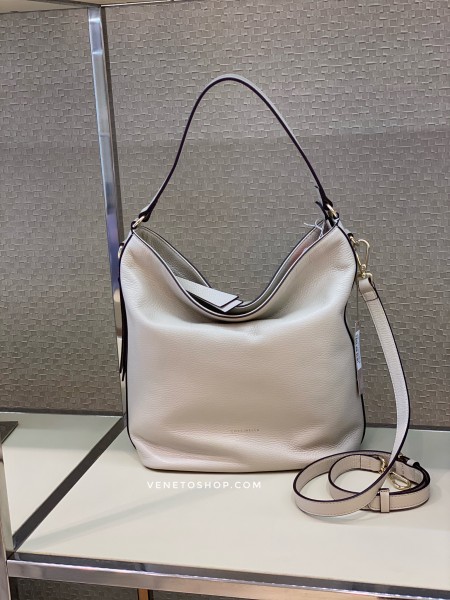 Кожаная сумка coccinelle jen с плечерыйм ремешком в комплекте , цвет бежевый seashell 27,5•31•15cm